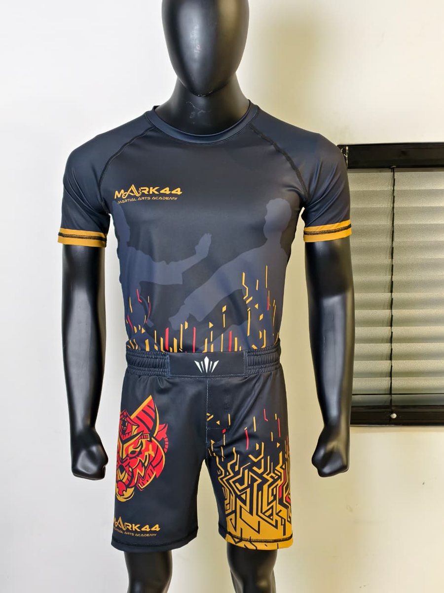 Custom fight kit designed for Mark 44 — matching rashguard and fight shorts.