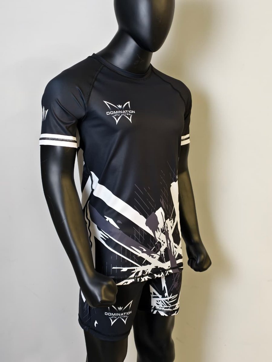 Custom fight kit designed for Domination Jiu Jitsu — matching rashguard and fight shorts.