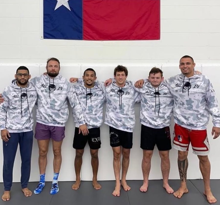 Team members of All in BJJ wearing custom Alva hoodies.