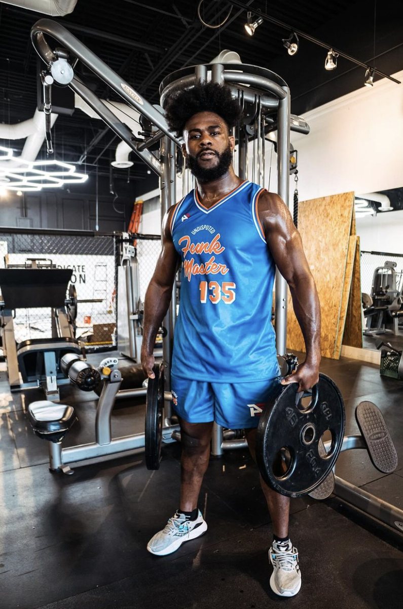 Custom fight kit designed for Aljamain Sterling — matching rashguard and fight shorts.
